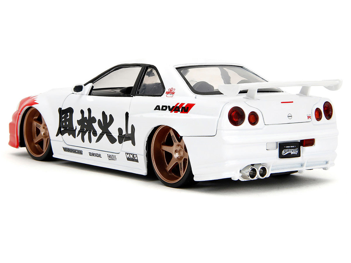 2002 Nissan Skyline GT-R (R34) RHD (Right Hand Drive) White with Red Graphics and Ryu Diecast Figure "Street Fighter" Video Game "Anime Hollywood Rides" Series 1/24 Diecast Model Car by Jada-1